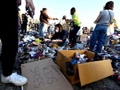 Thousands of people pick up clothes, foods and toiletries during a wildfire relief pop-up for those effected by the Eaton Fire, at Santa Anita Park in Arcadia, California, on January 11, 2025.
